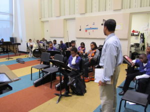One of the teachers instructing a classroom of students at Stax Academy
