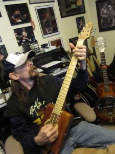 Mark Southwick playing one of his trademark Cigar Box Guitars