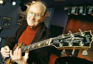 Les Paul with his Gibson namesake, the Les Paul guitar