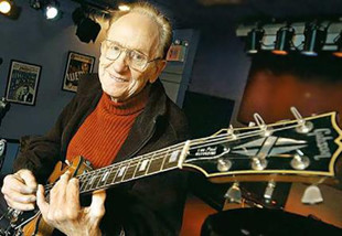 Les Paul with his Gibson namesake, the Les Paul guitar