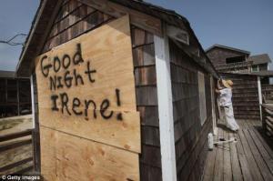 A window boarded in preparation for Hurricane Irene is spray painted with "good night Irene"
