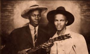 Robert Johnson poses with fellow blues musician Johnny Shines in the newly released photograph.