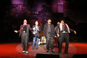 Jay Sielman (second on left) presents Ghost Town Blues Band with second place band award during 2014 International Blues Challenge